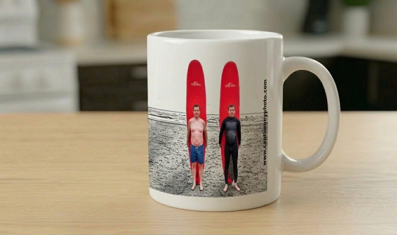 Mug printed with two surfers standing in front of red surfboards on a beach